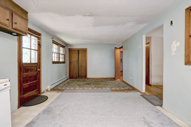 68 Highland Ave, East Haven, CT 06513 - entryway with a baseboard radiator and light carpet