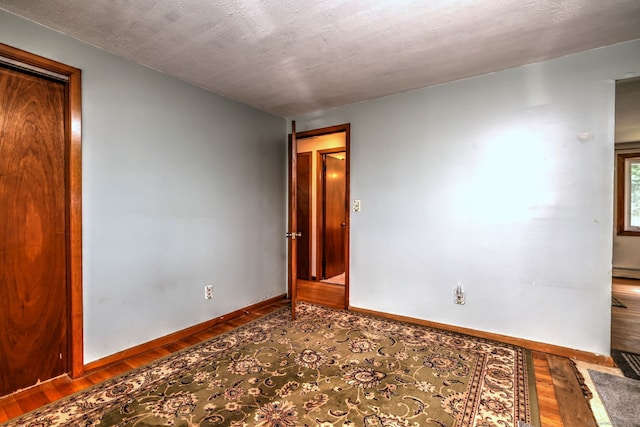 68 Highland Ave, East Haven, CT 06513 - unfurnished room with wood finished floors and a baseboard radiator