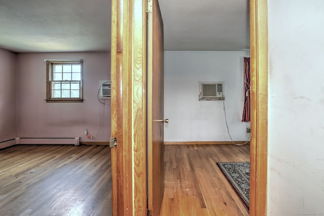 68 Highland Ave, East Haven, CT 06513 - corridor with wood finished floors, a wall mounted AC, and baseboard heating
