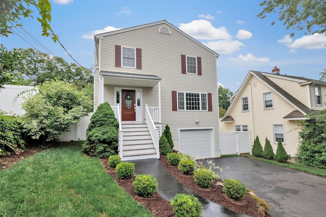 84 Edison Ave, Fairfield, CT 06825 - traditional home featuring asphalt driveway and an attached garage