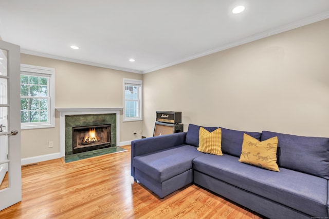 84 Edison Ave, Fairfield, CT 06825 - living room with ornamental molding, light wood-style floors, a fireplace with flush hearth, and recessed lighting