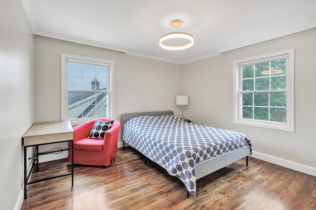 84 Edison Ave, Fairfield, CT 06825 - bedroom featuring multiple windows, ornamental molding, and wood finished floors