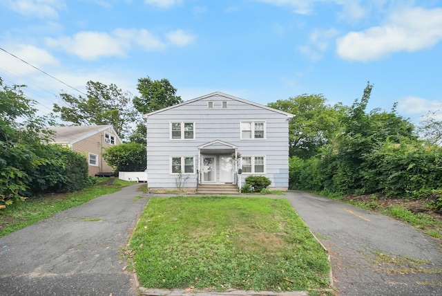 44 Pond St, Bridgeport, CT 06606 - traditional-style house featuring a front lawn and asphalt driveway