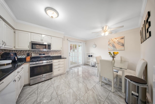 44 Pond St, Bridgeport, CT 06606 - kitchen featuring appliances with stainless steel finishes, backsplash, crown molding, white cabinets, and ceiling fan