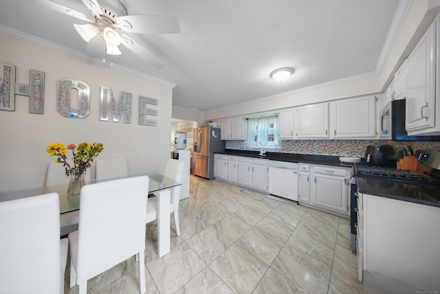 44 Pond St, Bridgeport, CT 06606 - kitchen featuring appliances with stainless steel finishes, crown molding, dark countertops, light marble finish floors, and ceiling fan