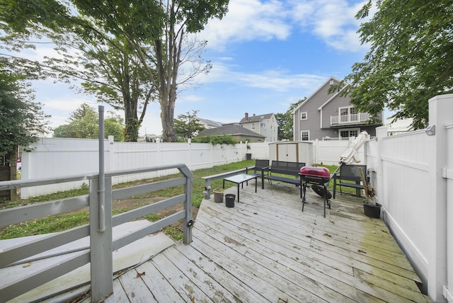 44 Pond St, Bridgeport, CT 06606 - wooden deck featuring a fenced backyard, a shed, grilling area, and a residential view