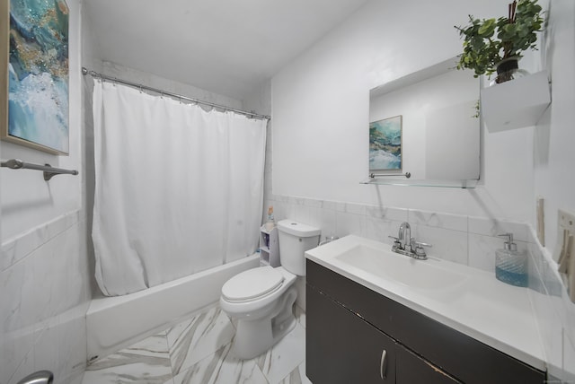 44 Pond St, Bridgeport, CT 06606 - bathroom featuring vanity, tile walls, shower / bath combo with shower curtain, a wainscoted wall, and marble finish flooring
