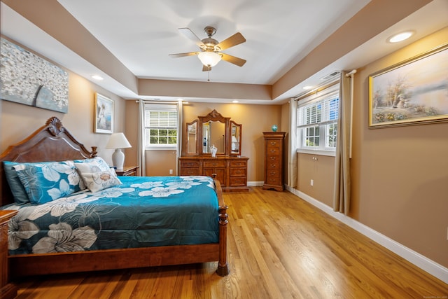 79 Orland St, Milford, CT 06460 - bedroom featuring wood finished floors, a tray ceiling, recessed lighting, and ceiling fan