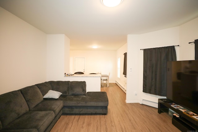 107 Dwight St, New Britain, CT 06051 - living room featuring baseboard heating and wood finished floors