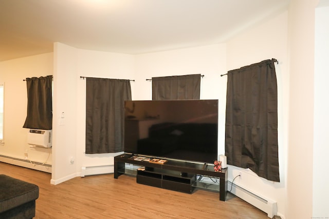 107 Dwight St, New Britain, CT 06051 - living room with baseboard heating, wood finished floors, and cooling unit