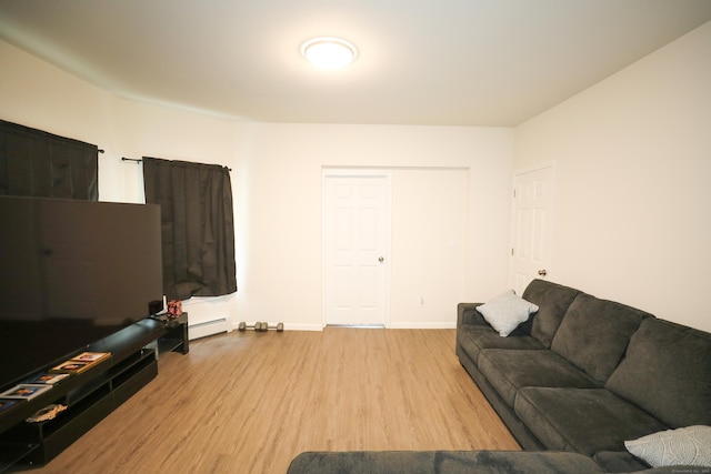 107 Dwight St, New Britain, CT 06051 - living room featuring wood finished floors and a baseboard heating unit