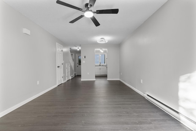 226 E Main St Apt 4, Bristol, CT 06010 - unfurnished living room with ceiling fan, a baseboard heating unit, and dark wood-style floors