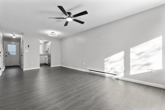 226 E Main St Apt 4, Bristol, CT 06010 - unfurnished living room with a baseboard radiator, a ceiling fan, and dark wood-style flooring