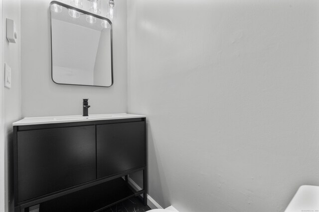 226 E Main St Apt 4, Bristol, CT 06010 - bathroom with vanity and baseboards