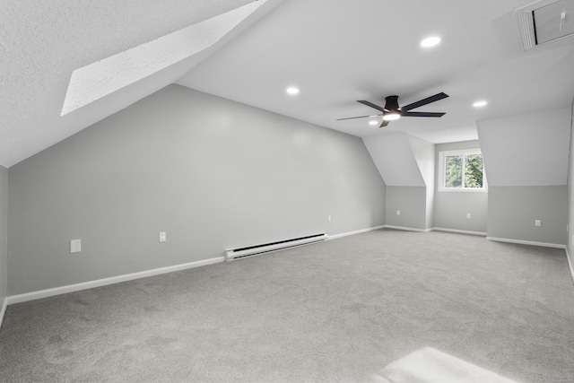 226 E Main St Apt 4, Bristol, CT 06010 - bonus room featuring baseboard heating, a skylight, vaulted ceiling, recessed lighting, and carpet flooring