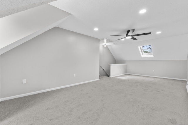 226 E Main St Apt 4, Bristol, CT 06010 - additional living space with vaulted ceiling, ceiling fan, a skylight, recessed lighting, and carpet