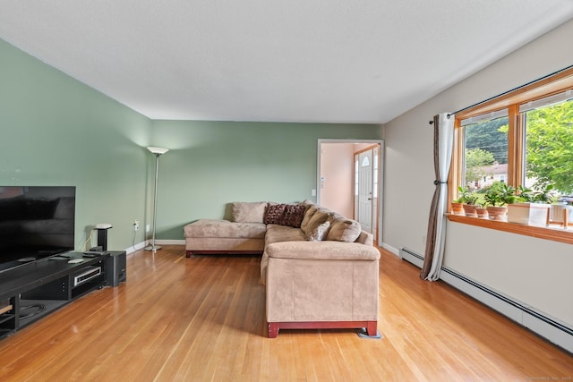61 Mansfield Rd, New London, CT 06320 - living room with baseboard heating and light wood-style flooring