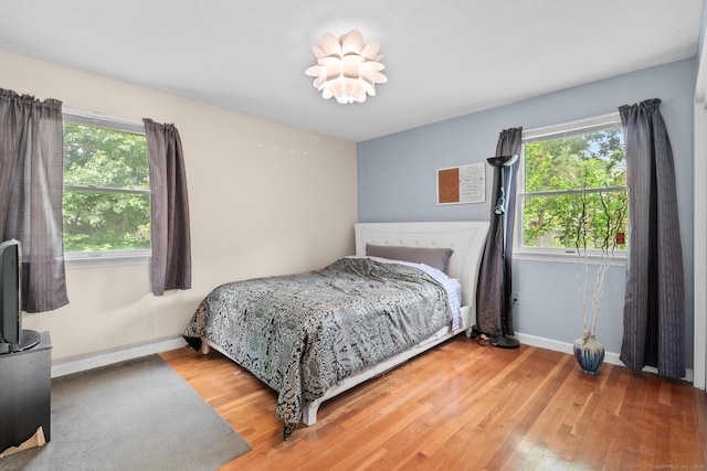 61 Mansfield Rd, New London, CT 06320 - bedroom featuring wood finished floors and multiple windows
