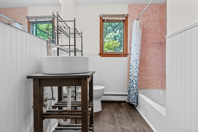61 Mansfield Rd, New London, CT 06320 - full bathroom featuring wood finished floors, shower / bath combo, and a baseboard heating unit