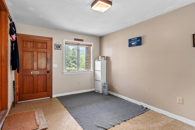 61 Mansfield Rd, New London, CT 06320 - foyer with baseboards and a textured ceiling