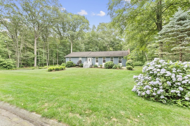 477 Skyline Dr, Orange, CT 06477 - view of front of home with a front lawn and a chimney