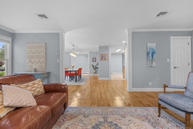 477 Skyline Dr, Orange, CT 06477 - living room with light wood-style floors, crown molding, and decorative columns