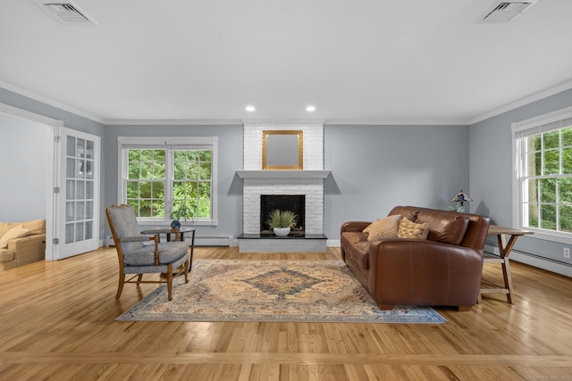 477 Skyline Dr, Orange, CT 06477 - living area featuring crown molding, a brick fireplace, baseboard heating, wood finished floors, and recessed lighting