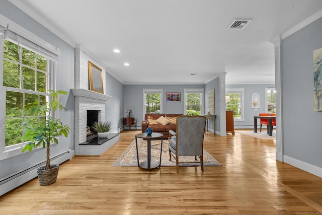 477 Skyline Dr, Orange, CT 06477 - living area featuring a baseboard radiator, ornamental molding, recessed lighting, a brick fireplace, and light wood-type flooring
