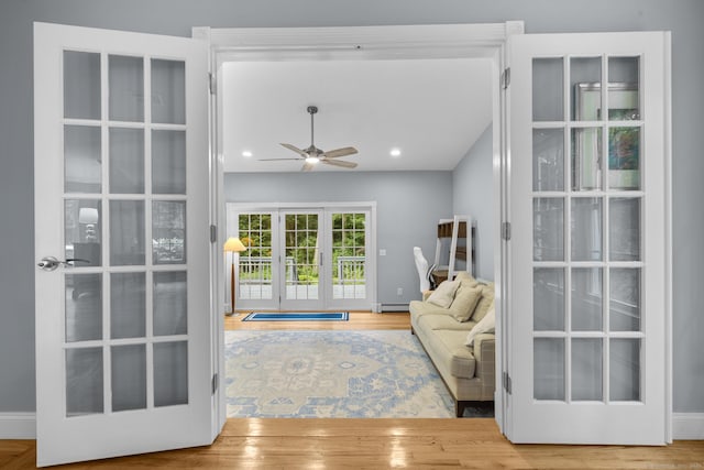 477 Skyline Dr, Orange, CT 06477 - living area with french doors, a baseboard heating unit, wood finished floors, a ceiling fan, and recessed lighting