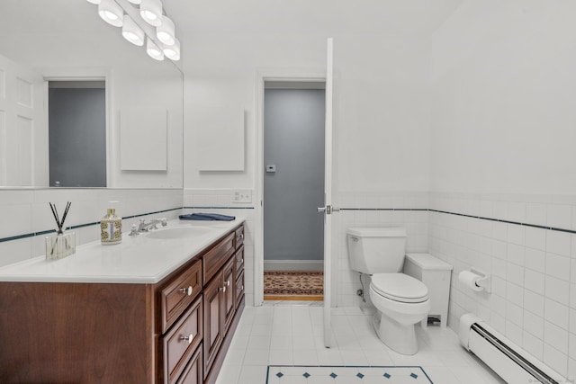 477 Skyline Dr, Orange, CT 06477 - bathroom featuring a baseboard heating unit, vanity, tile patterned floors, tile walls, and a wainscoted wall