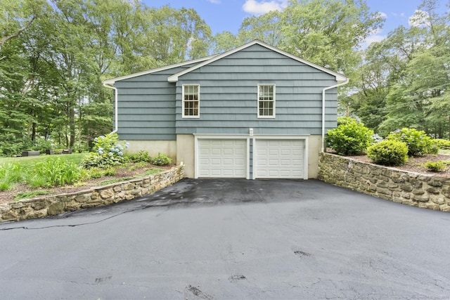 477 Skyline Dr, Orange, CT 06477 - view of property exterior featuring asphalt driveway and a garage