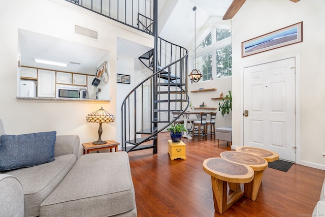 278 Carriage Crossing Ln Unit 278, Middletown, CT 06457 - living room with high vaulted ceiling, wood finished floors, stairway, and a ceiling fan