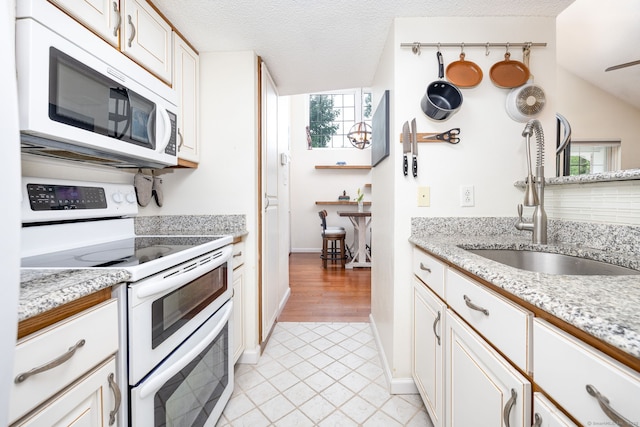 278 Carriage Crossing Ln Unit 278, Middletown, CT 06457 - kitchen featuring white appliances, white cabinets, light tile patterned floors, a textured ceiling, and ceiling fan