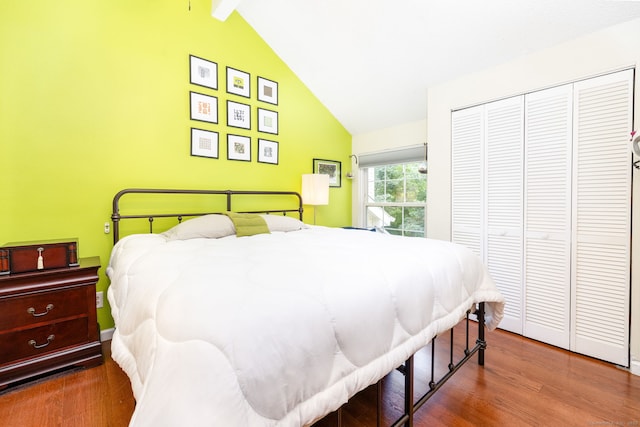 278 Carriage Crossing Ln Unit 278, Middletown, CT 06457 - bedroom featuring wood finished floors, a closet, high vaulted ceiling, and beam ceiling