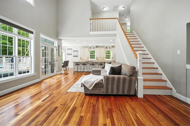 31 Galbraith Rd, Stafford, CT 06071 - living area with a towering ceiling, stairway, healthy amount of natural light, and light wood finished floors