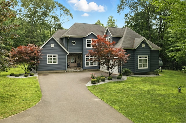 31 Galbraith Rd, Stafford, CT 06071 - view of front of house featuring asphalt driveway and a front yard