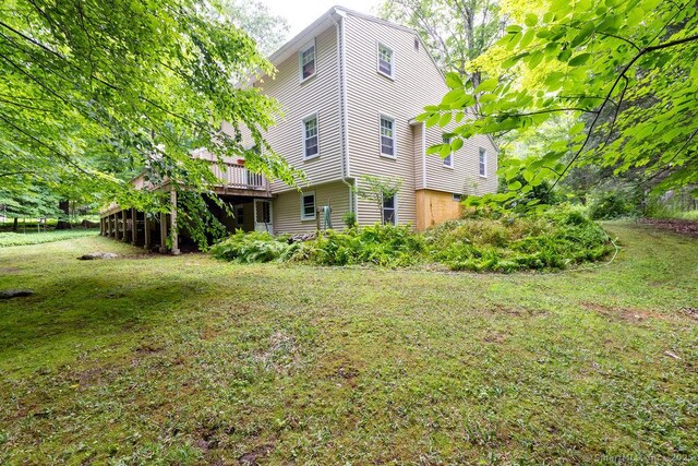 169 Wheeling Rd, Andover, CT 06232 - view of green lawn with a wooden deck