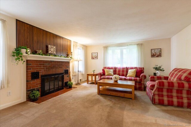 169 Wheeling Rd, Andover, CT 06232 - carpeted living area with a brick fireplace and baseboards