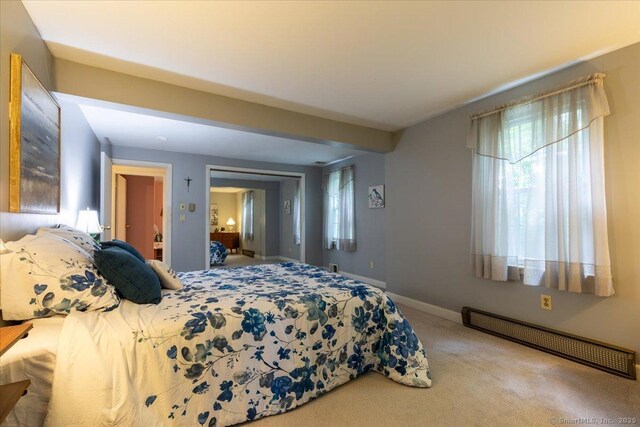 169 Wheeling Rd, Andover, CT 06232 - carpeted bedroom featuring a baseboard radiator and baseboards