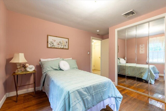 169 Wheeling Rd, Andover, CT 06232 - bedroom featuring wood-type flooring and a closet