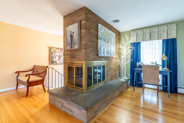 4 Melburn Ave, East Hampton, CT 06424 - living area featuring wood finished floors and a fireplace