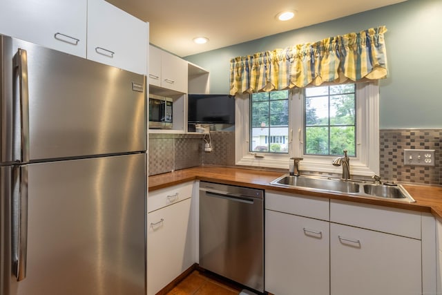 4 Melburn Ave, East Hampton, CT 06424 - kitchen with stainless steel appliances, butcher block counters, white cabinetry, tasteful backsplash, and recessed lighting
