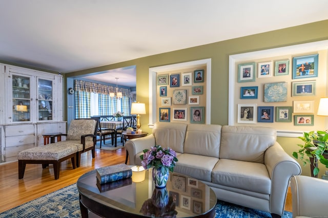 4 Melburn Ave, East Hampton, CT 06424 - living area featuring a chandelier and wood finished floors