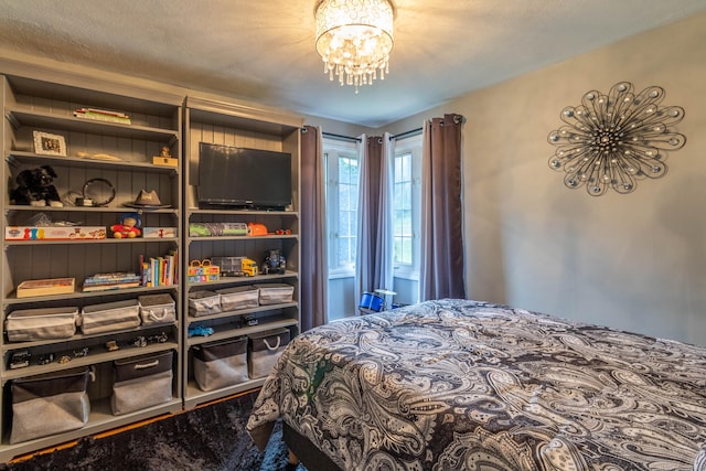 4 Melburn Ave, East Hampton, CT 06424 - bedroom featuring a chandelier