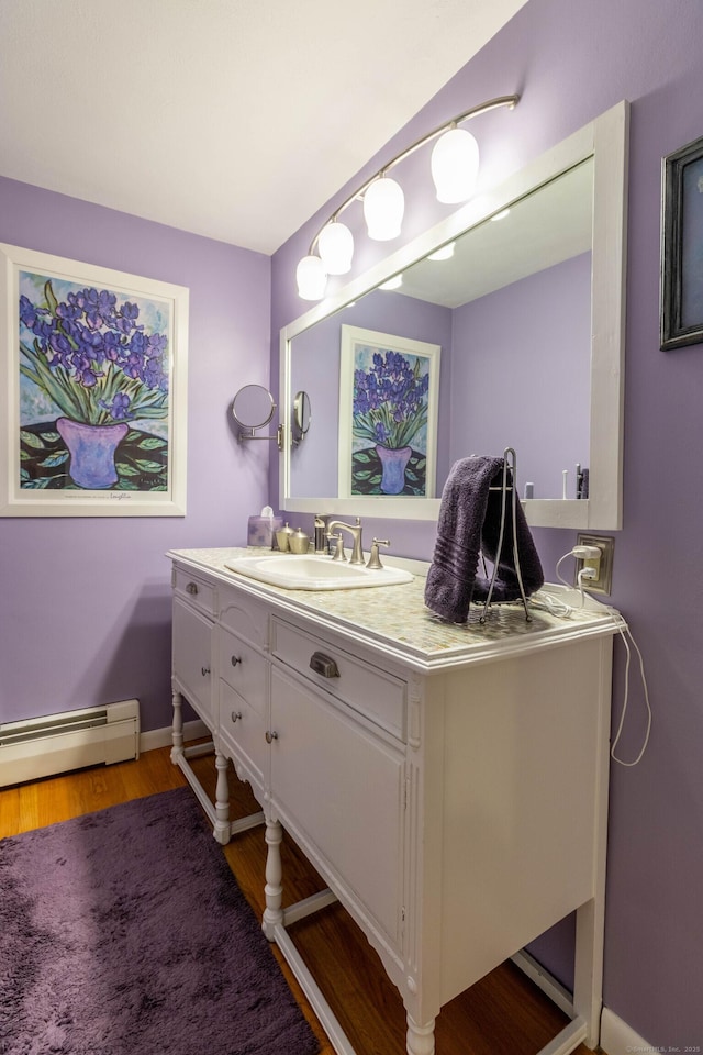 4 Melburn Ave, East Hampton, CT 06424 - bathroom with a baseboard radiator, vanity, and wood finished floors