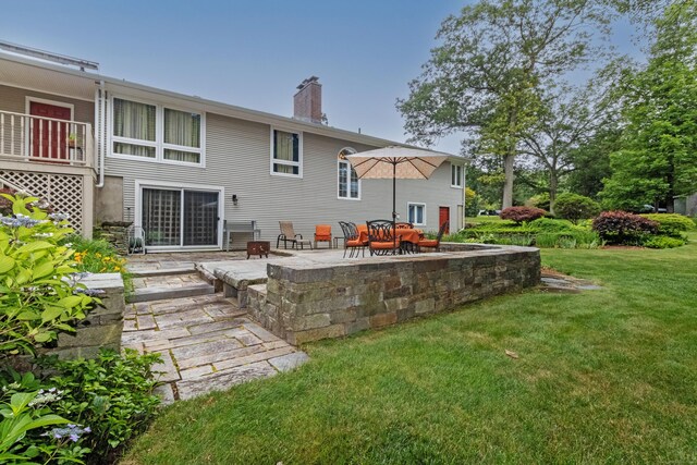 4 Melburn Ave, East Hampton, CT 06424 - rear view of house featuring a patio area, a chimney, and a yard