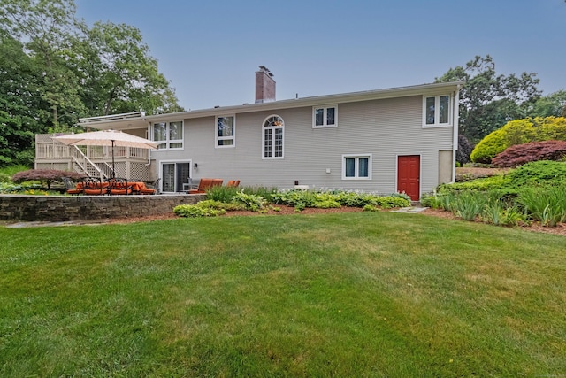 4 Melburn Ave, East Hampton, CT 06424 - rear view of house with a lawn, a chimney, a deck, and stairway