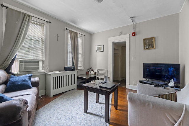 1492 Dixwell Ave, Hamden, CT 06514 - living room featuring wood finished floors, cooling unit, and radiator