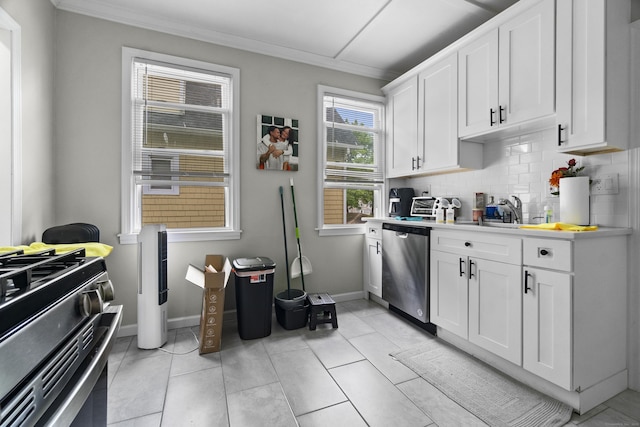 1492 Dixwell Ave, Hamden, CT 06514 - kitchen featuring dishwasher, ornamental molding, tasteful backsplash, gas range oven, and white cabinets