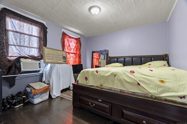 1492 Dixwell Ave, Hamden, CT 06514 - bedroom featuring dark wood-type flooring, a textured ceiling, and cooling unit